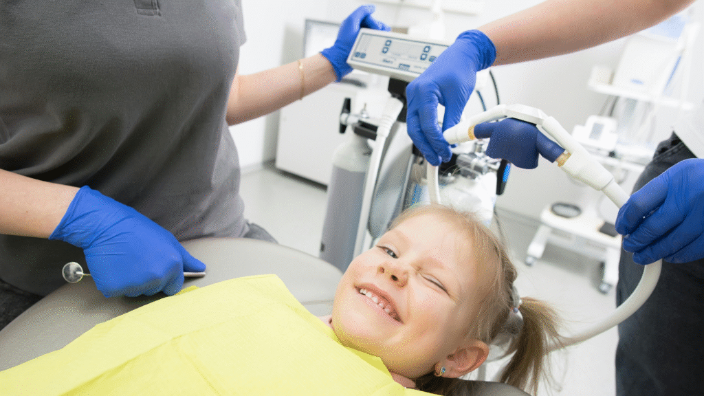 happy young child receiving a pediatric dental exam in Dardenne Prairie, MO